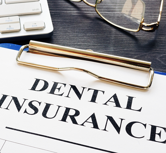 Dental insurance form on a clipboard