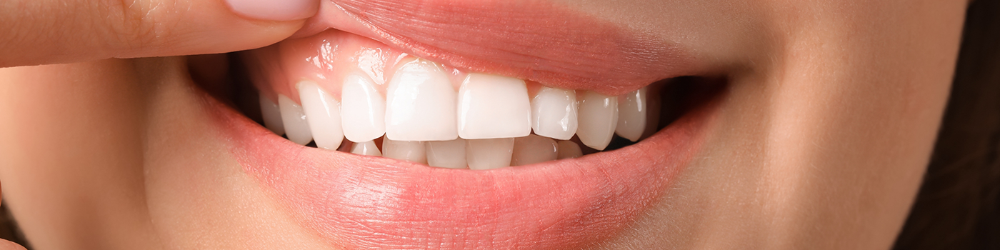 Close up of woman pulling up her lip