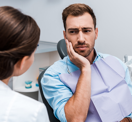 Man visiting emergency dentist in Bradford for toothache