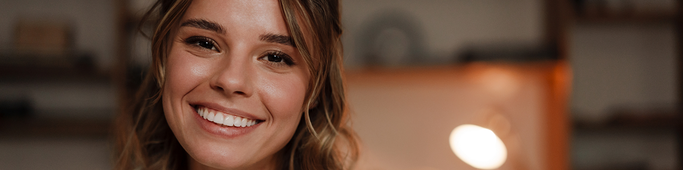 Close up of woman with wavy hair smiling