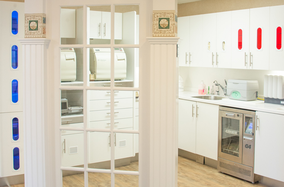 Windowed door leading to area with cabinets