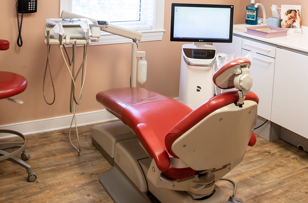Treatment area with red dental chair