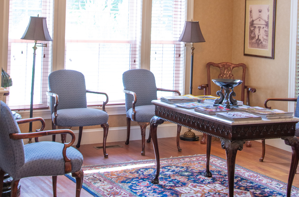 Waiting room with fancy table and chairs